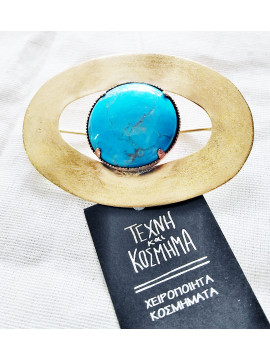 Cabochon-cut turquoise stone brooch